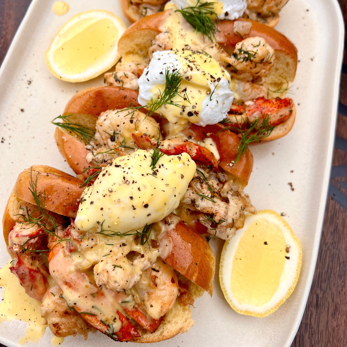 lobster roll eggs Benedict with poached eggs and Hollandaise sauce