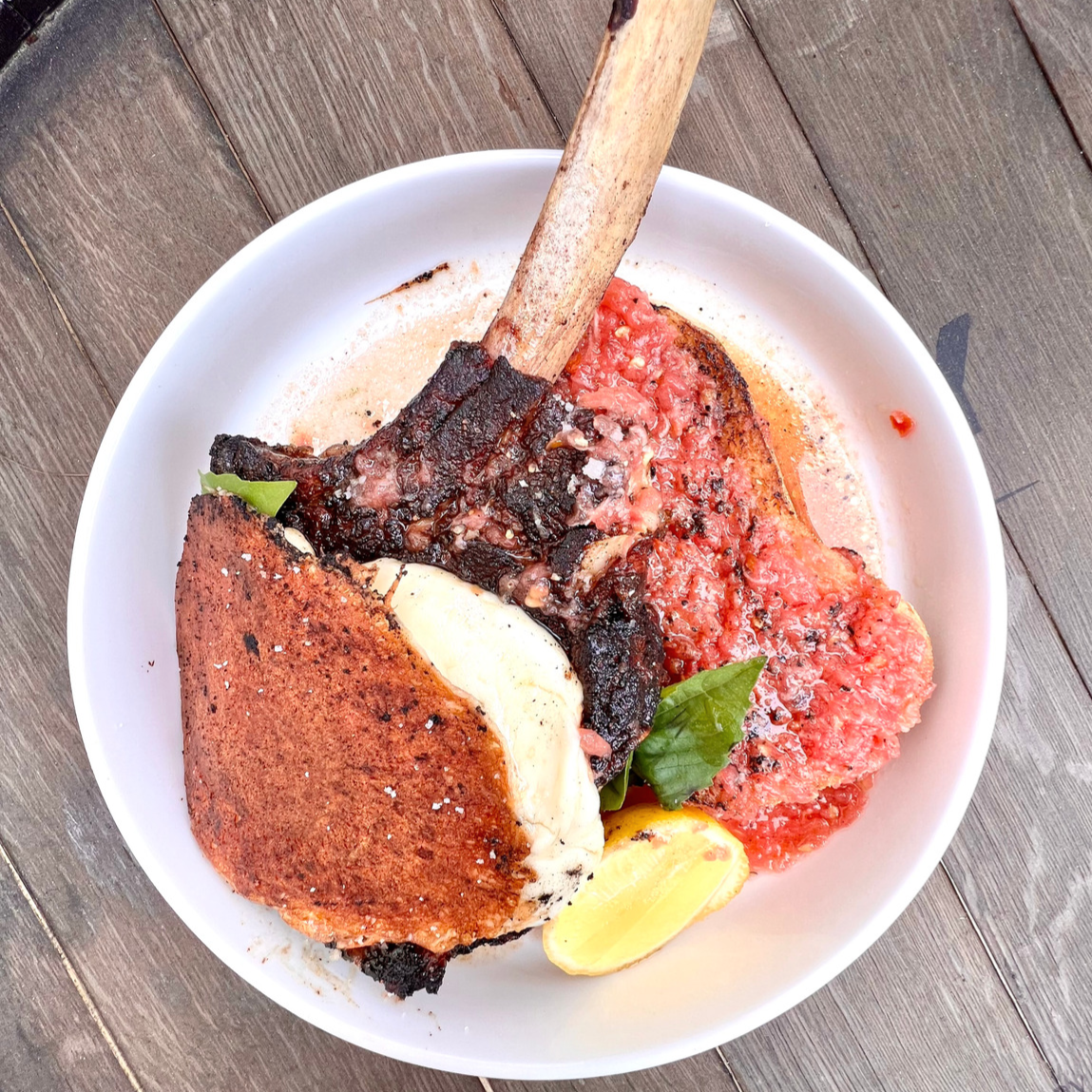 smoked and sear veal chop with pan con tomate and grilled mozzarella cheese