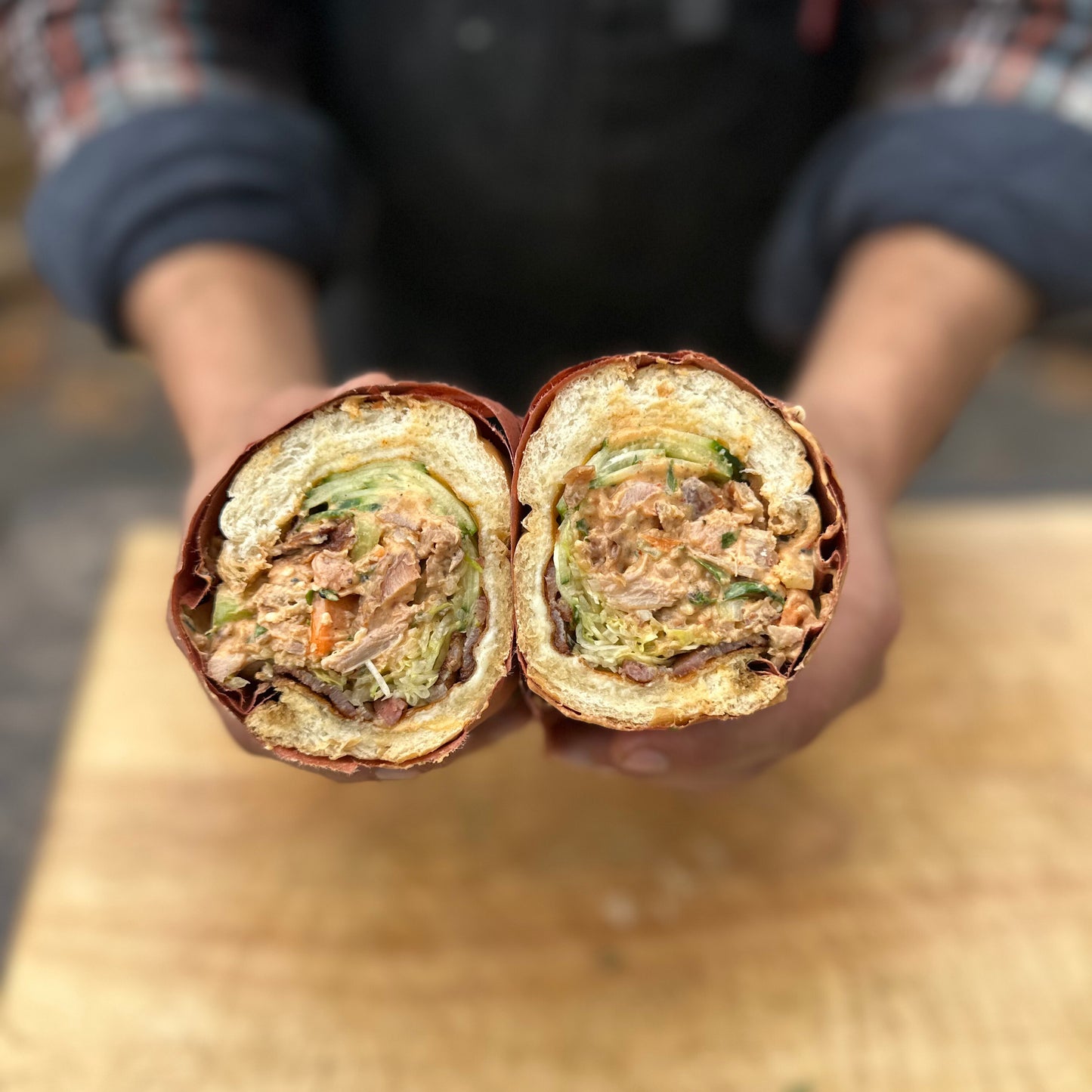 smoked turkey and bacon banh mi sub sandwich cut in half