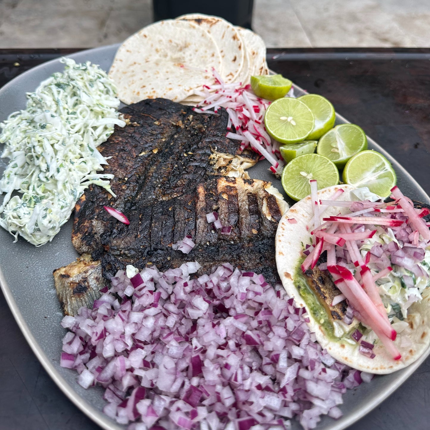 a grilled branzino taco platter