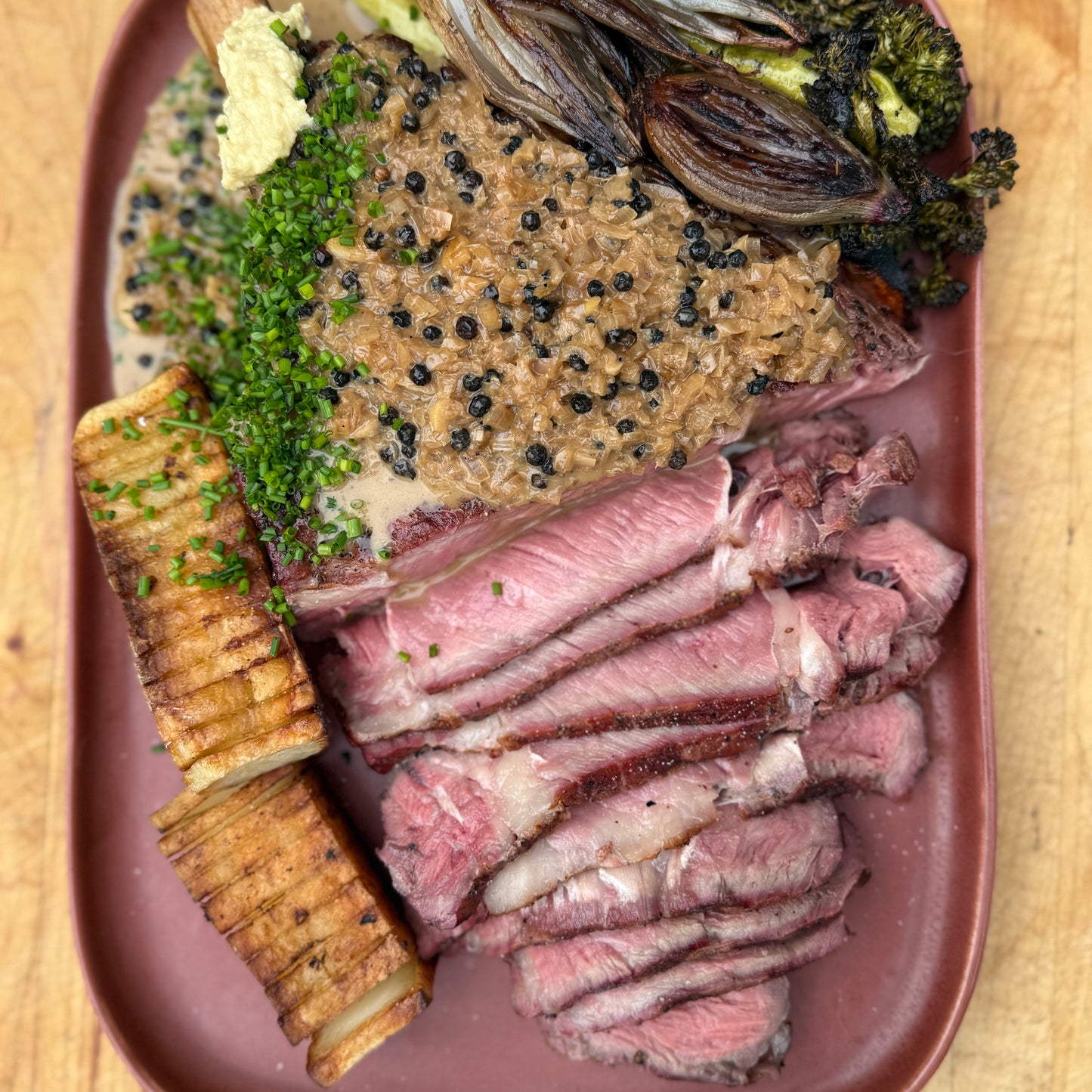 smoked steak au poivre with dominoes potatoes and broccolini