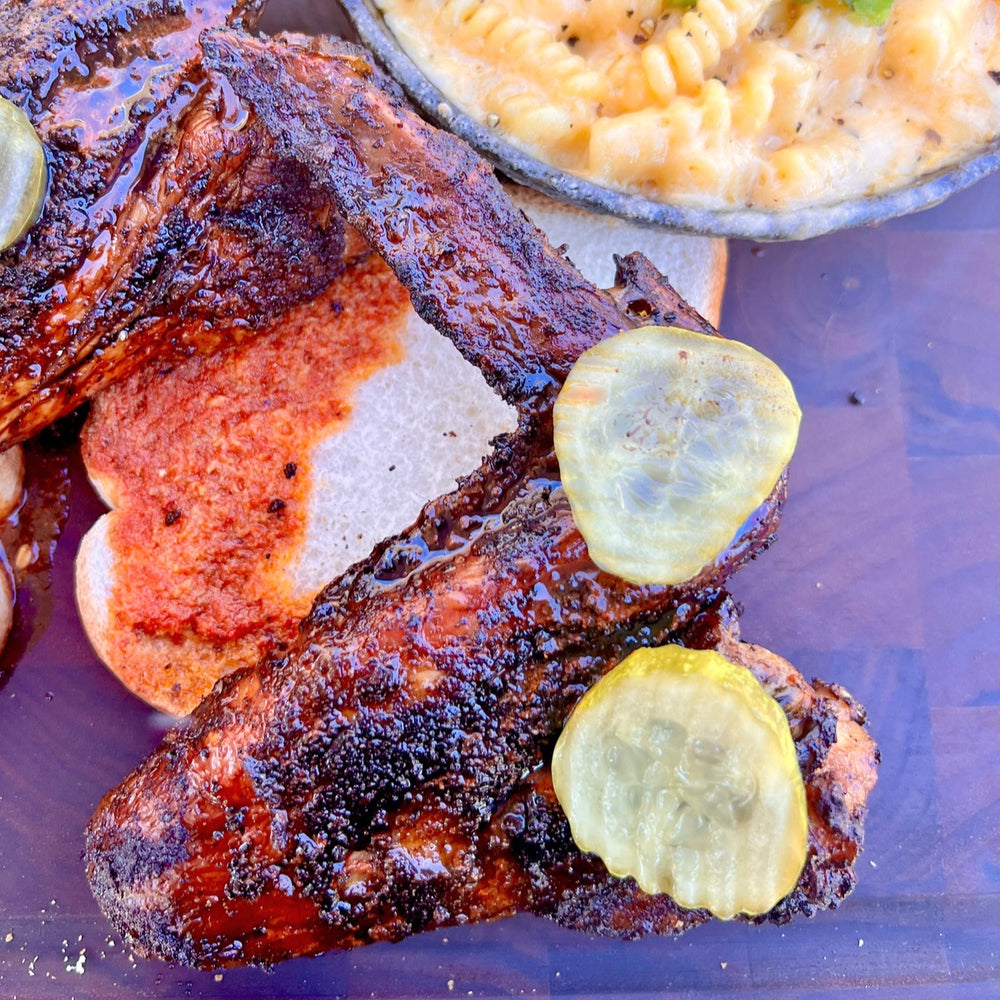 Nashville hot smoked turkey wings with white bread, pickles and mac and cheese
