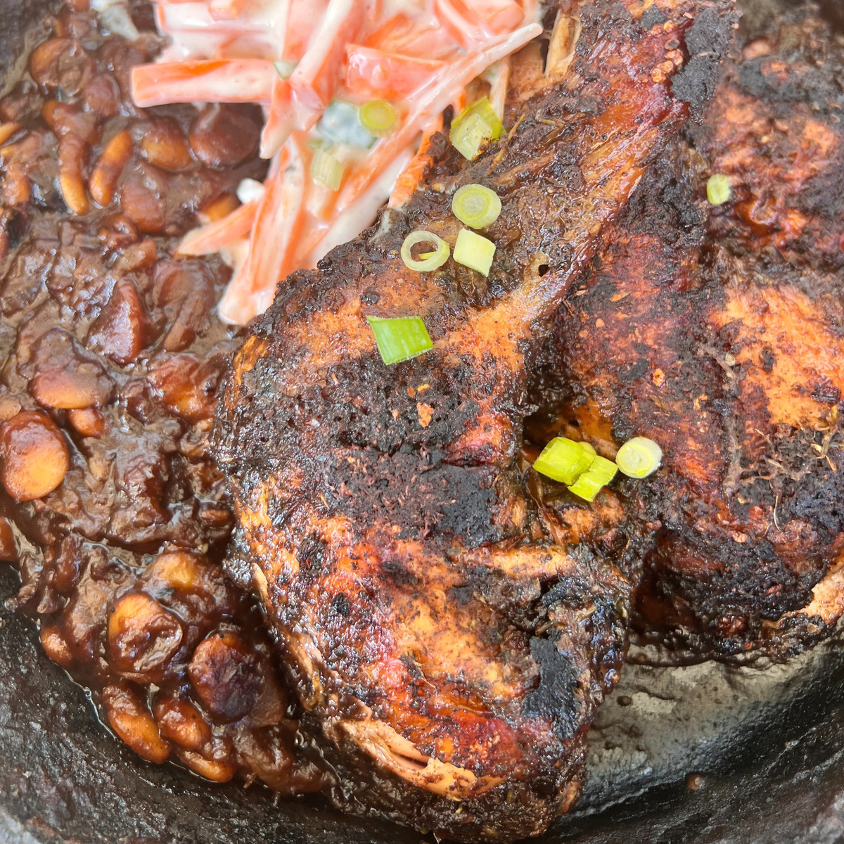 smoked jerk chicken legs with maple baked beans and creamy coleslaw