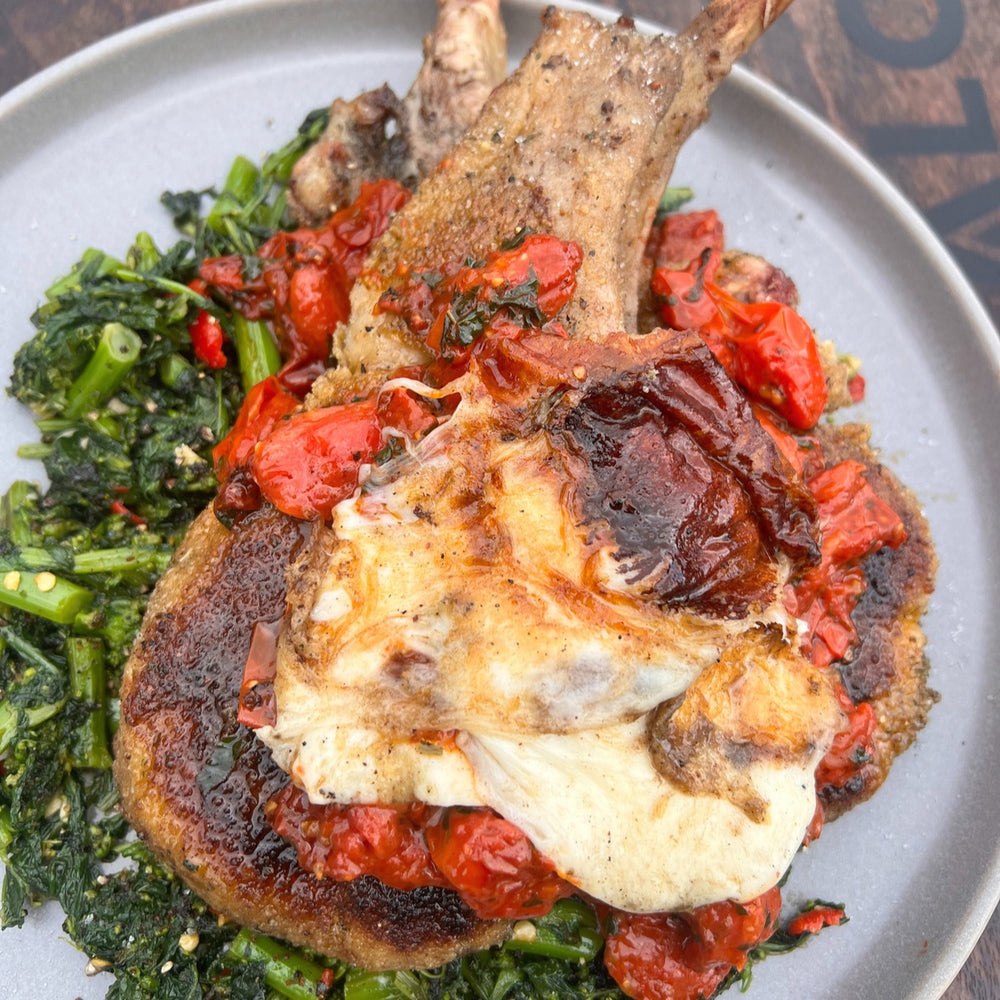 smoked pork chop milanese with chili-garlic rapini and grilled mozzarella