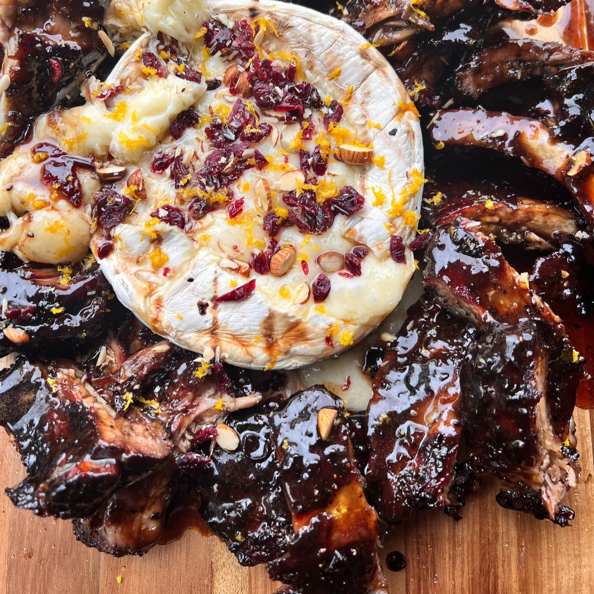 smoked baby back ribs with black currant bbq sauce and smoked brie