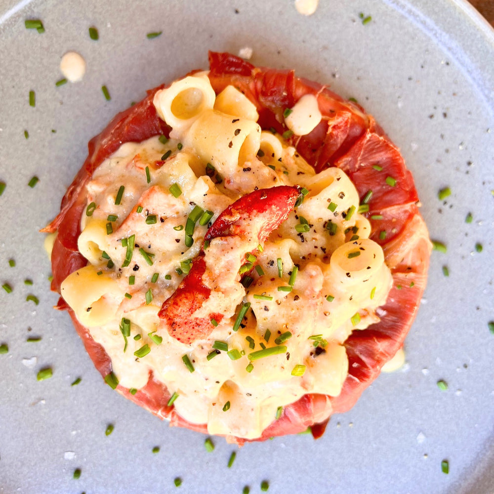 smoked prosciutto-wrapped brie with lobster mac and cheese