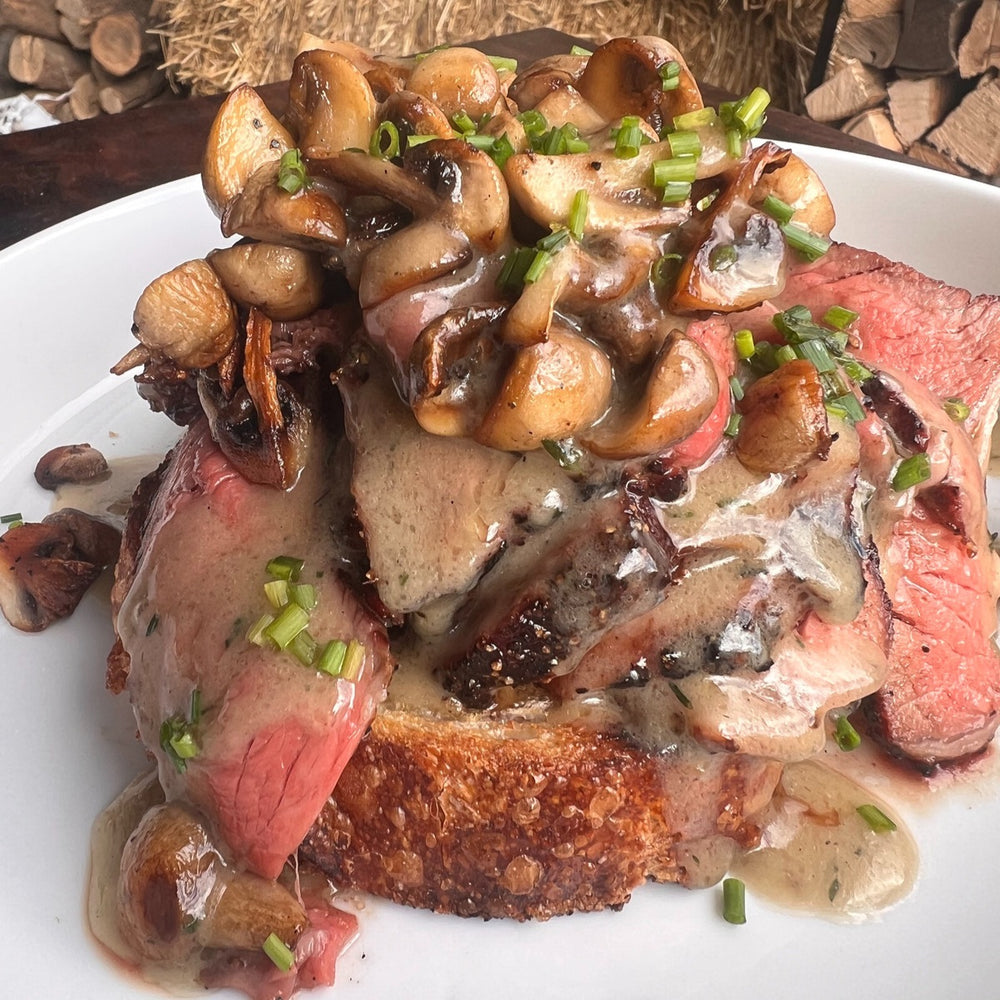 open-faced smoked beef sandwich with grilled mushrooms and gravy
