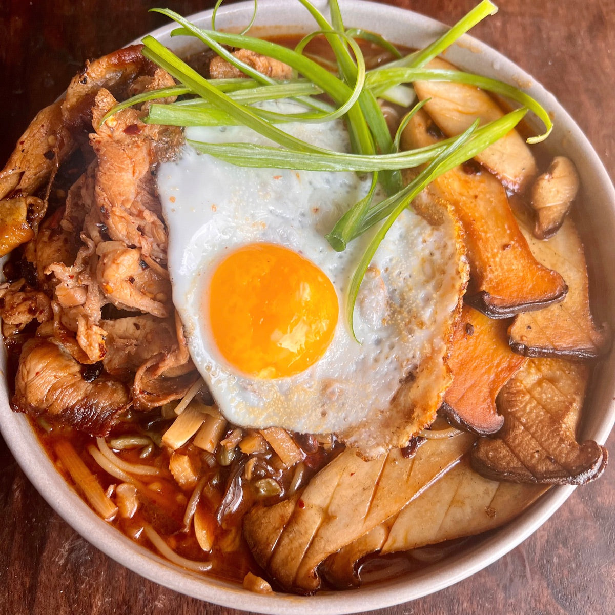 amped up instant noodles with grilled pork and mushrooms and a fried egg