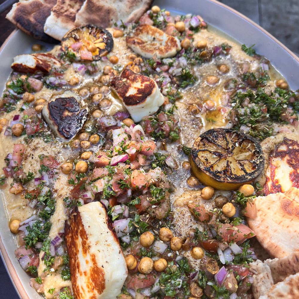 smoked hummus and grilled halloumi platter with crispy chickpeas and pita