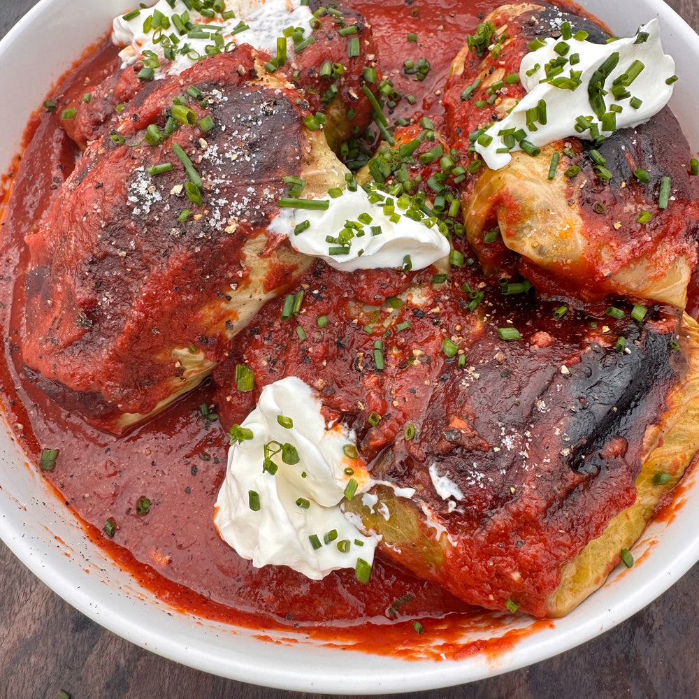 smoked cabbage rolls with sour cream and chopped chives