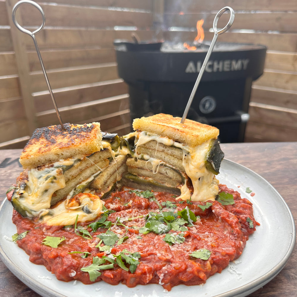 poblano grilled cheese on a plate with red sauce