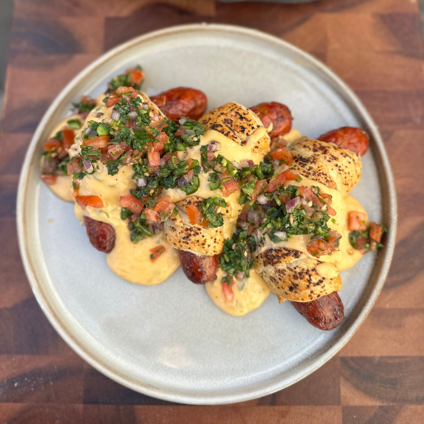 chorizo sausage rolls with queso fundido and pico