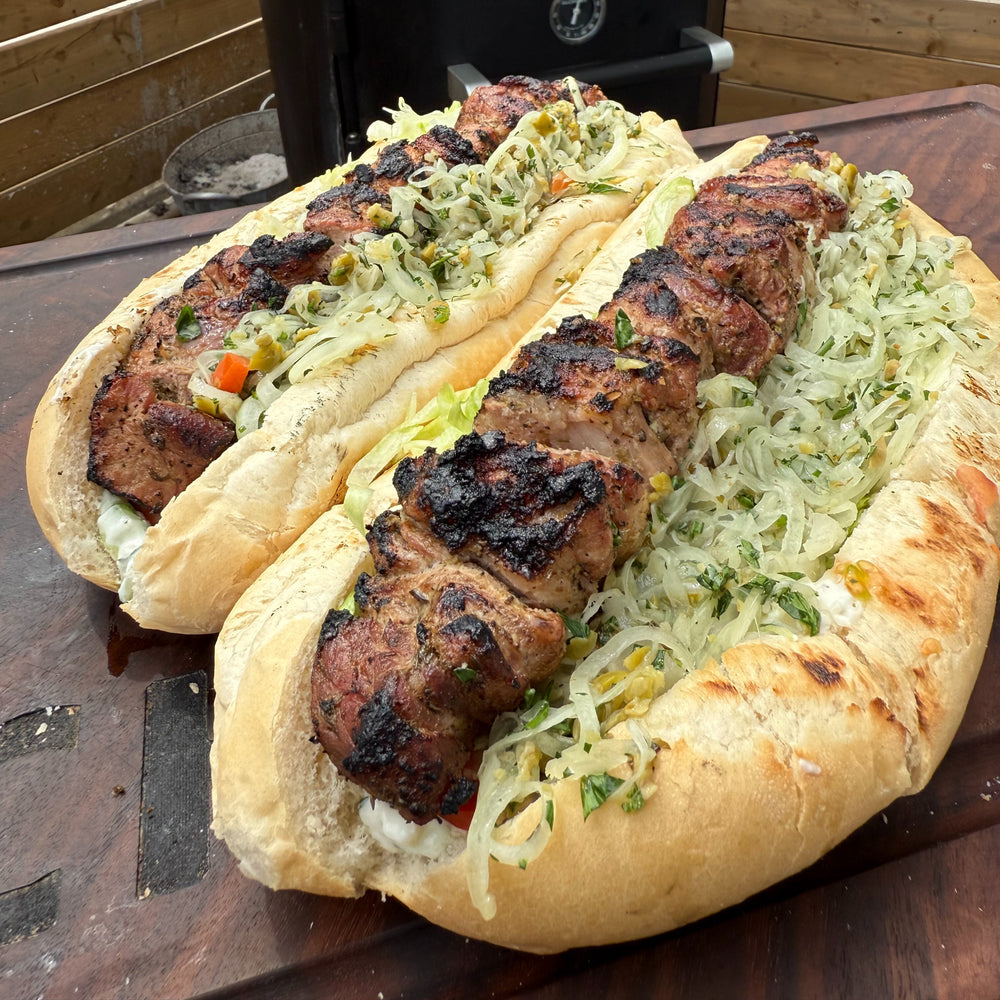 smoked pork souvlaki on a bun