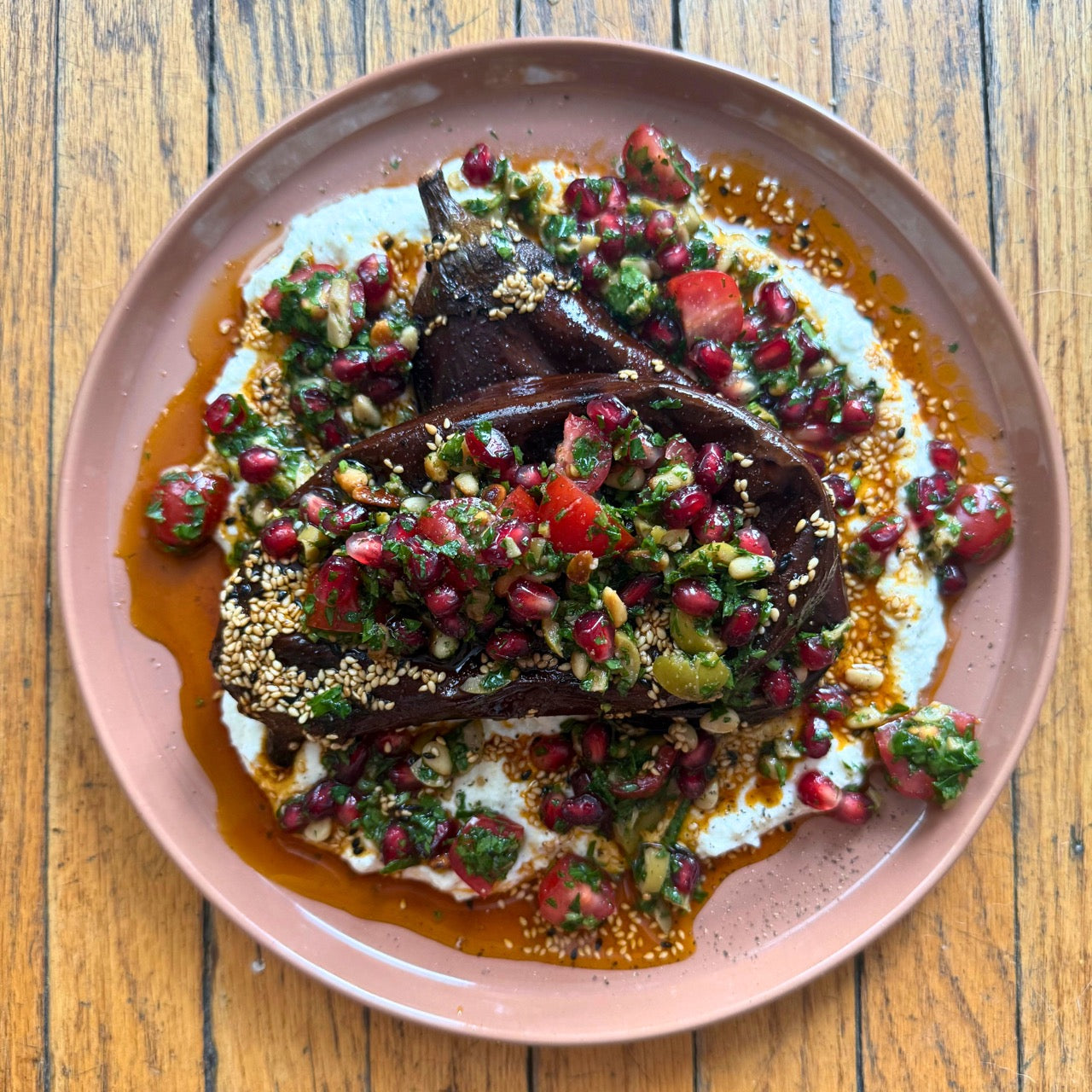 grilled and smoked eggplant with garlic feta yogurt, pine nuts and pomegranate seeds