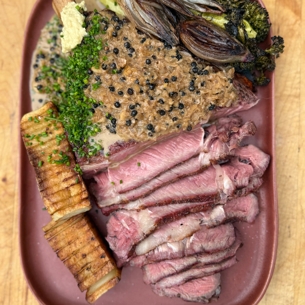 smoked steak au poivre with dominoes potatoes and broccolini 